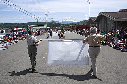 Independence Day parade in 2014.  Mount Rainier can be seen in background.