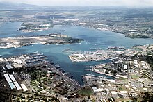 Pearl Harbor is the home of the largest U.S. Navy fleet in the Pacific. The harbor was attacked on December 7, 1941, by the Japanese Empire, bringing the United States into World War II. Aerial view of Pearl Harbor on 1 June 1986 (6422248).jpg