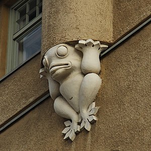 A frog statue supporting a pilaster on the Agronomy House in Helsinki, Finland