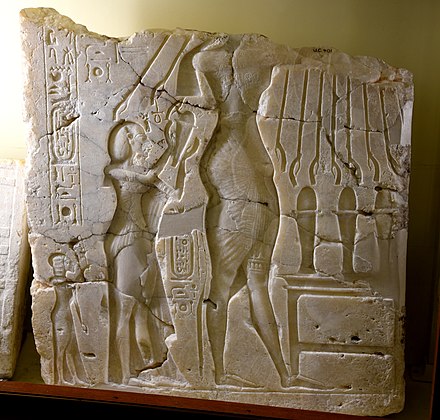 Alabaster sunken relief depicting Akhenaten, Nefertiti, and daughter Meritaten. Early Aten cartouches on king's arm and chest. From Amarna, Egypt. 18th Dynasty. The Petrie Museum of Egyptian Archaeology, London