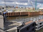 Amsterdam, photo 2016 of canals, free download; water locks in the canal Westerkanaal with the IJ river in the background under cloudy sky. Fons Heijnsbroek, photography of The Netherlands in high resolution; free image