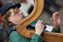 Harp player. Amsterdam, The Netherlands