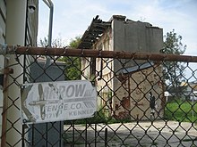 A dilapidated chain link fence signals that the building it is protecting is not very secured, while a well maintained bush indicates risk due to evidence of recent activity. ArrowFenceTremeBanksy.jpg