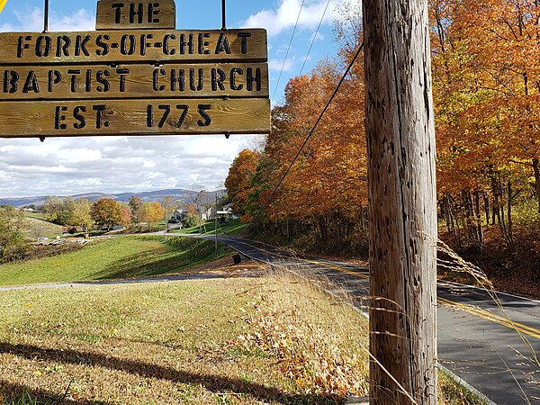 Forks-Of-Cheat Baptist Church sign on Stewartstown Road, reflecting the region's early beginnings.