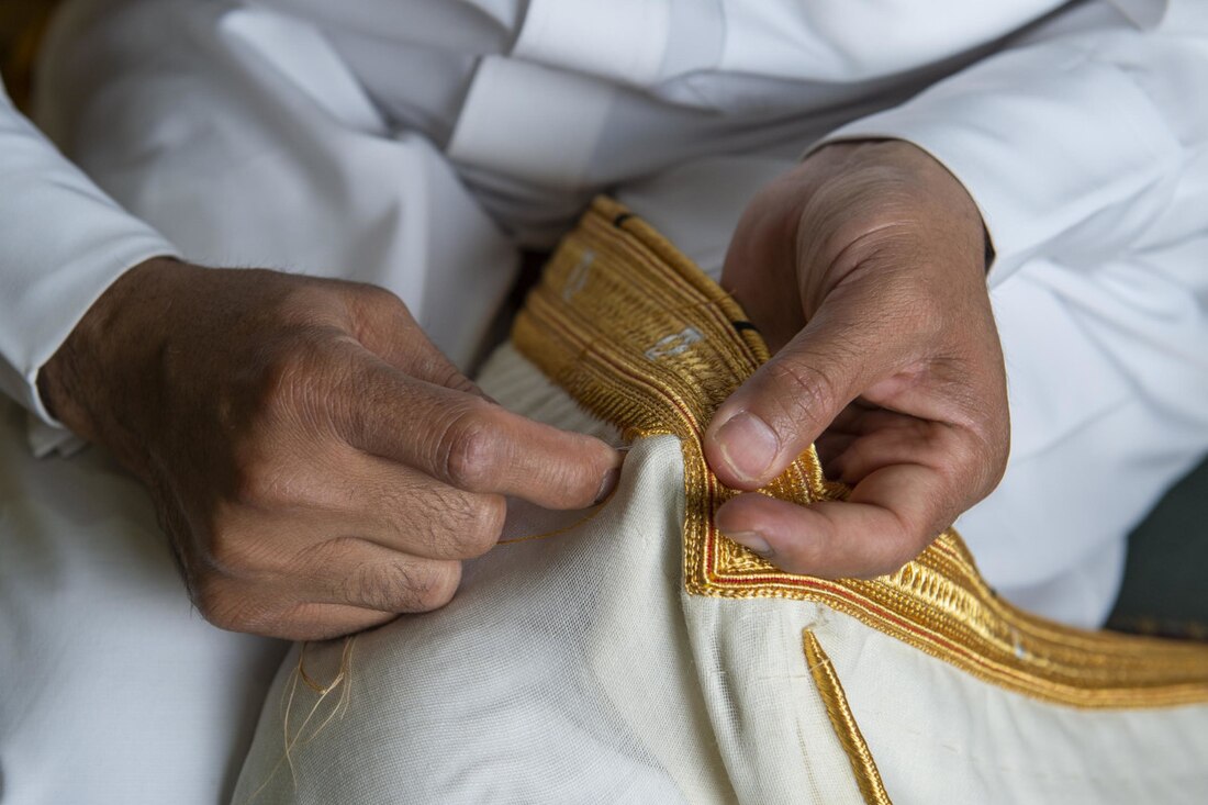 File:Bisht Being Sewn.jpg