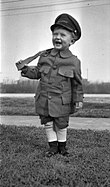 Boy with wooden toy gun, 1920s Boy Marine Outfit.jpg
