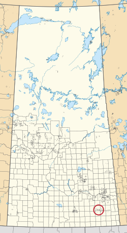 Саскачеван провинциясының картасы, 297 ауылдық муниципалитеттер мен жүздеген шағын үнді қорықтарын көрсетеді. Біреуі қызыл шеңбермен ерекшеленеді.