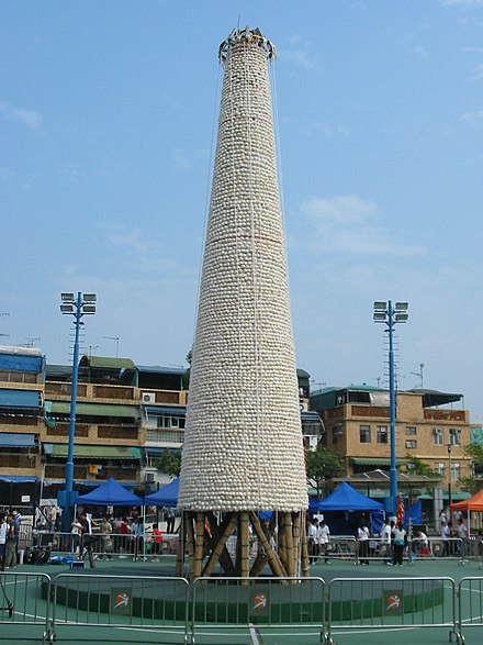 A bun tower being prepared for the festival.