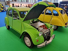 A Citroën 2CV retrofitted with an electric drivetrain on display.