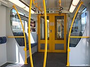Refurbished vestibule of an ex G set. The luggage racks above the seats, designed for longer distance travel, were not removed when the train was converted to a T set.