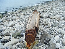 One of three remaining parts of the destroyed crane lying along the eastern coastline. Durdle Pier Portland Crane Remains.JPG