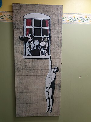 Earl Grey Inn - a copy (not an original) of a Banksy artwork is installed in the men's toilets. Earl Grey Banksy Toilet.jpg