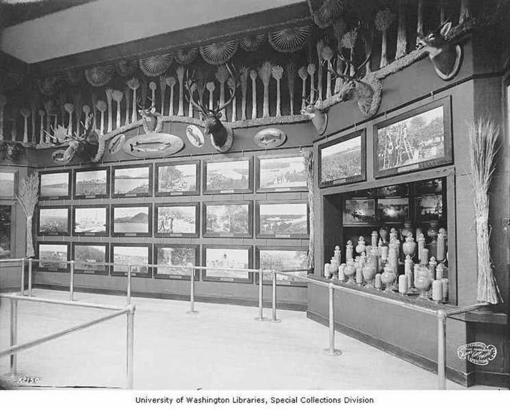 File:Exhibit of photos, hunting trophies and jars of grain, Grand Trunk Railway Building, Alaska-Yukon-Pacific-Exposition, Seattle (AYP 1119).jpeg