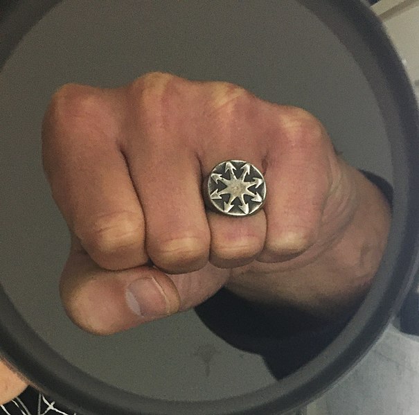 File:Fist in mirror with chaos magic finger ring (cropped).jpg