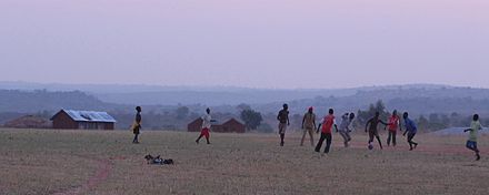 A football game in Arua, with the mountains in the background