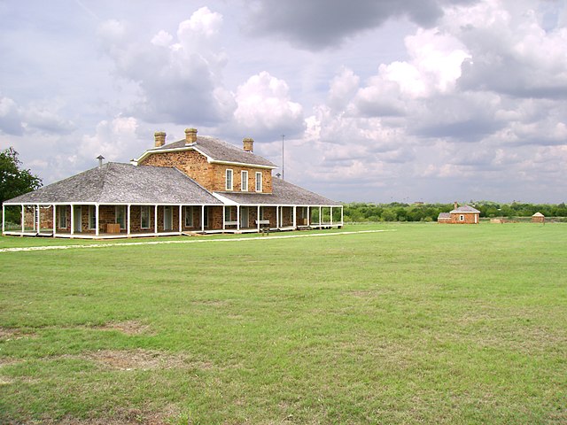 Looking across Fort Richardson's parade ground toward the hospital. The bakery, guardhouse and magazine are visible in the background.
