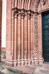 Slender Gothic columns at a portal of Marienkirche Gelnhausen [de] (Gelnhausen, Germany)