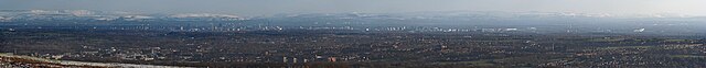 A panoramic view of the Greater Manchester conurbation, from Matchmoor Lane on the western side of Winter Hill. Bolton is the large town in the foregr