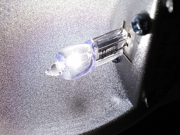 A halogen lamp operating in its fitting with the protecting glass removed