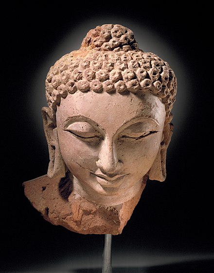 Head of Buddha Shakyamuni, Devnimori, Gujarat (375-400). Derived from the Greco-Buddhist art of Gandhara, an example of the Western Indian art of the Western Satraps.[82][83]