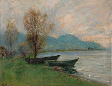 Lake shore with boats and mountains in the background label QS:Len,"Lake shore with boats and mountains in the background" -