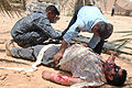 Iraqi police officers evaluate a causality after a simulated explosion during a crime scene exploitation training exercise at Asad Air Base, Iraq, July 6, 2011 110706-A-EM978-016.jpg