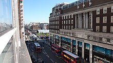 Hereford House of 1928-1930: flats and department store on the south side of the Street (Primark, formerly C&A). Ireland -v Brazil in London (4404461690).jpg