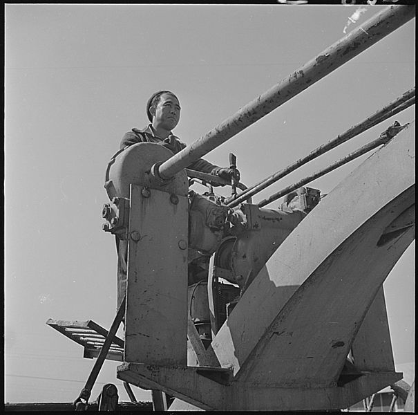 File:Jerome Relocation Center, Denson, Arkansas. Maintaining centerroadways, despite Arkansas rainy spri . . . - NARA - 539340.jpg