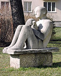 Sitting boy with animal