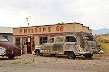 Phillips 66 gas station and American Linen Supply Company delivery van