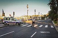 The white truck, a Renault Midlum,[47] in the distance on the Promenade des Anglais on the morning after the attack