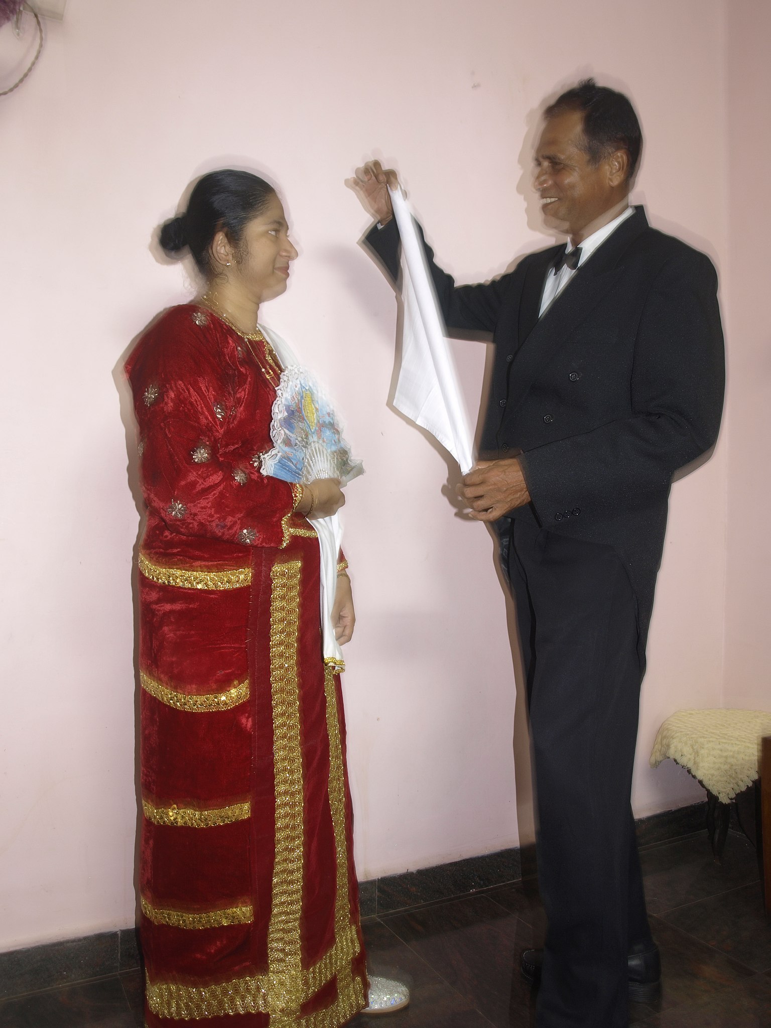 File:Performers of the Mando song-dance form pose for a photo on a rainy day  outside their home in Curtorim.jpg - Wikipedia