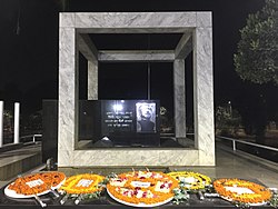 A memorial monument at the lakeshore in front of the museum Monuments of Bangabandhu memorial museum, Dhaka.jpg