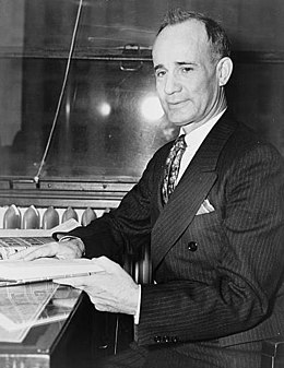 Napoleon Hill seated with book TGR.jpg