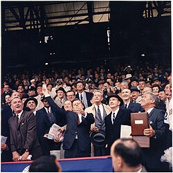 1961 President John F. Kennedy throws out the first ball in opening day. Opening Day of 1961 Baseball Season. President Kennedy throws out first ball. (first row) Vice President Johnson... - NARA - 194197.jpg