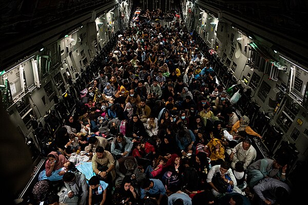 Fleeing civilians aboard a US Air Force transport plane at Kabul Airport on 19 August 2021