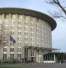 Picture of the building of the OPCW, flying an OPCW flag