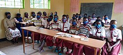 Photo of Burundian students wearing masks to protect themselves against Corona virus in a classroom.jpg