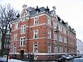 Apartment building in half-open development