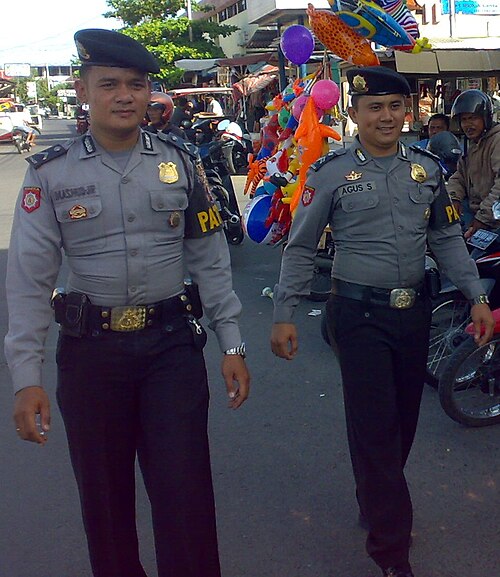 Indonesian National Police officers conducting a foot patrol