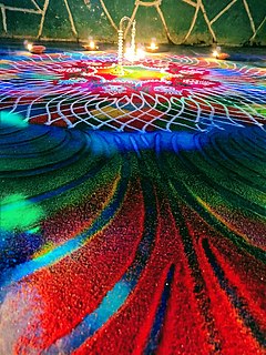 Rangoli Traditional art form of India, in which a basic design is drawn with powdered mineral calcite or dry rice flour. Later may be filled with different things like coloured powders, coloured sand or salt, flowers and leaves on the ground