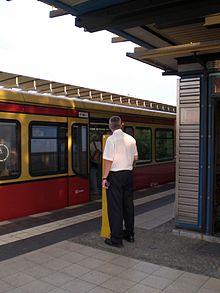 Classic platform dispatcher with central control - the operated electric switch is connected to the signal at the start of the platform that the train driver can see. S-Bahn Berlin Abfertiger.jpg