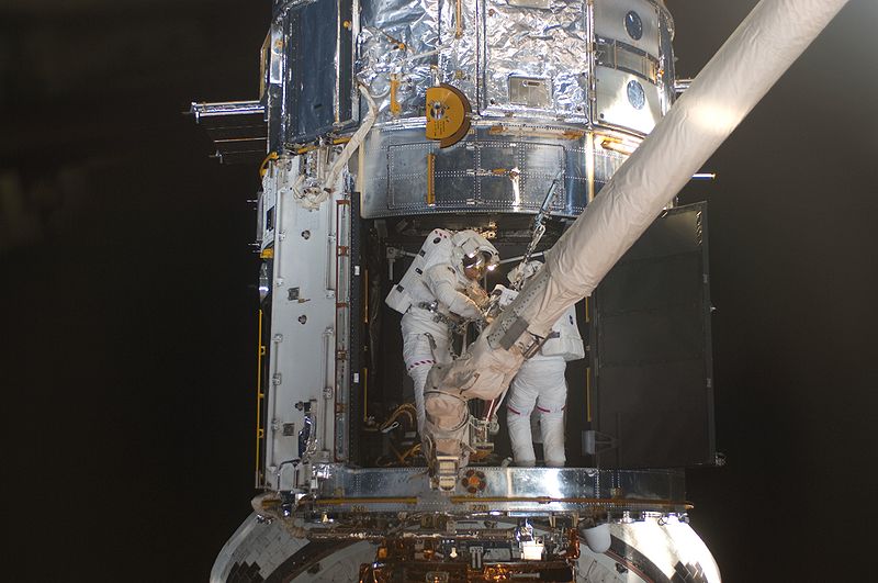 File:STS-125 EVA4 Working inside Hubble.jpg