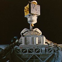 Satcom K1 being placed into orbit by the Space Shuttle Columbia in 1986. The illuminated (right hand) side of the satellite is one set of solar panels which were extended when the satellite propelled itself to its geostationary orbit STS-61-C SATCOM Ku-1 deployment.jpg