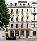 Café Fledermaus;  Residential and commercial building in closed development (Salomonstrasse 1) with the original shop front and front building with shop and café in front as an acute-angled low-rise building (both Berliner Strasse 51