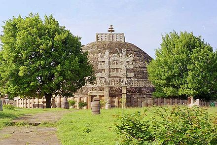 The stupa, which contained the relics of Buddha, at the center of the Sanchi complex was originally built by the Maurya Empire, but the balustrade around it is Sunga, and the decorative gateways are from the later Satavahana period.