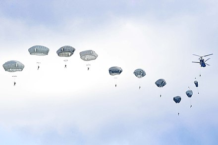 US parachutists jump from a Chinook over Germany in 2019