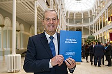 Lord Smith of Kelvin holding the Commission's report Smith report unveiling.jpg