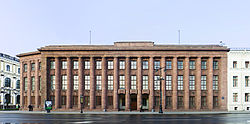 The German Imperial Embassy (designed 1911-12) on Saint Isaac's Square in Saint Petersburg is considered the key template for Stripped Classicism. It was stripped still further when the large statues originally placed on the plinth on the roof were removed during World War I St. Petersburg, German Embassy.jpg