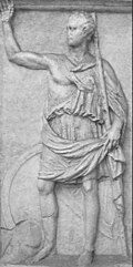 A monochrome relief stele depicting a man in classical Greek clothing raising one arm